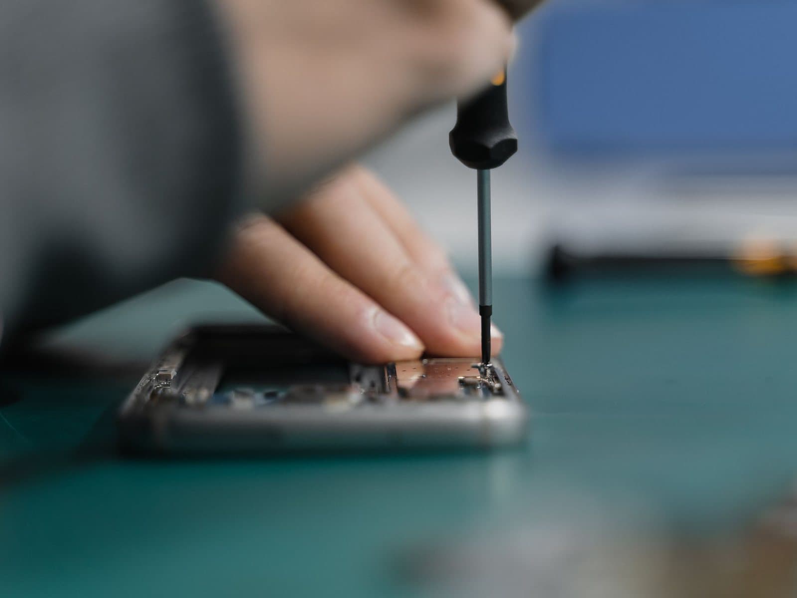A technician working on a phone